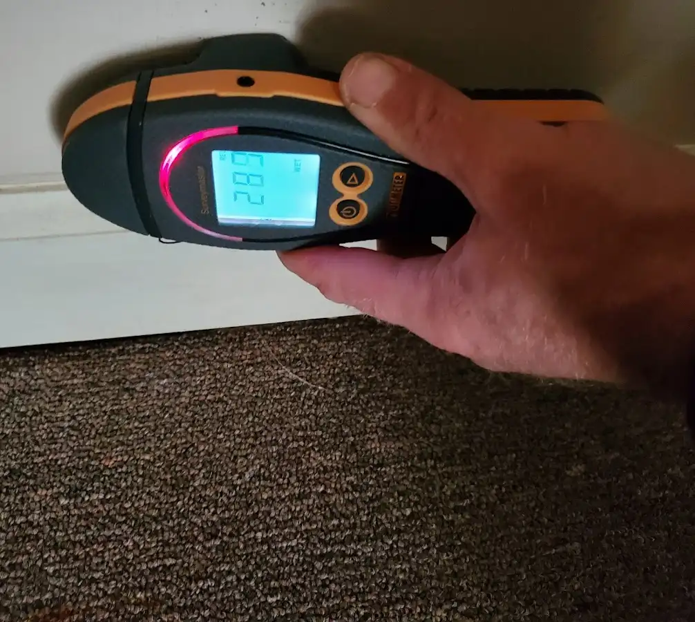Moisture detection at baseboard during Storm Damage Restoration in Sartell